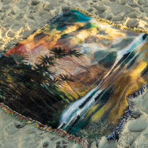 red sky at night, blanket on beach